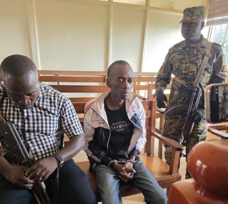 202604Christopher-Okello-Onyum-guarded-by-security