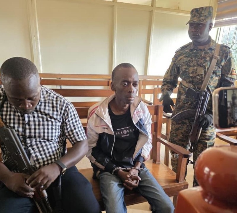 202604Christopher-Okello-Onyum-guarded-by-security