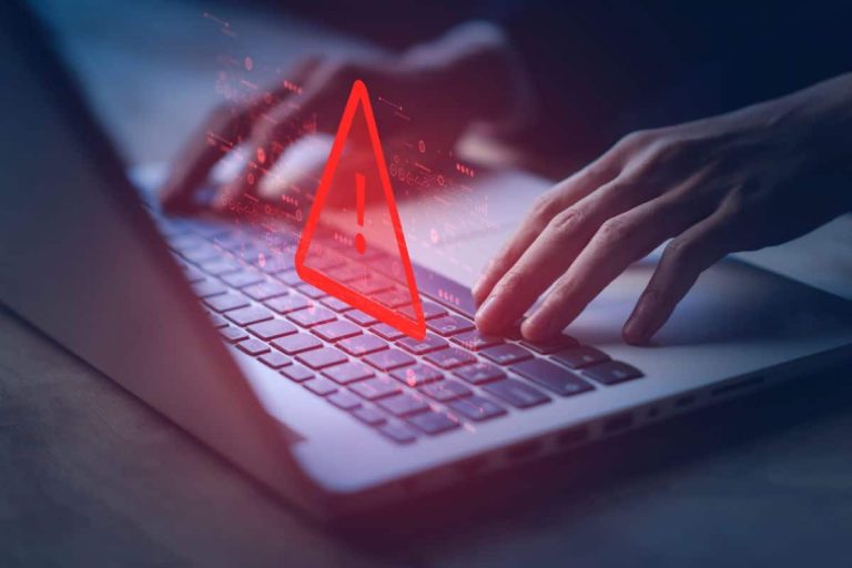 System hacked warning alert on notebook (Laptop). Cyber attack on computer network, Virus, Spyware, Malware or Malicious software. Cyber security and cybercrime. Compromised information internet.