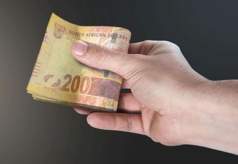 Hand Passing Wad Of Cash