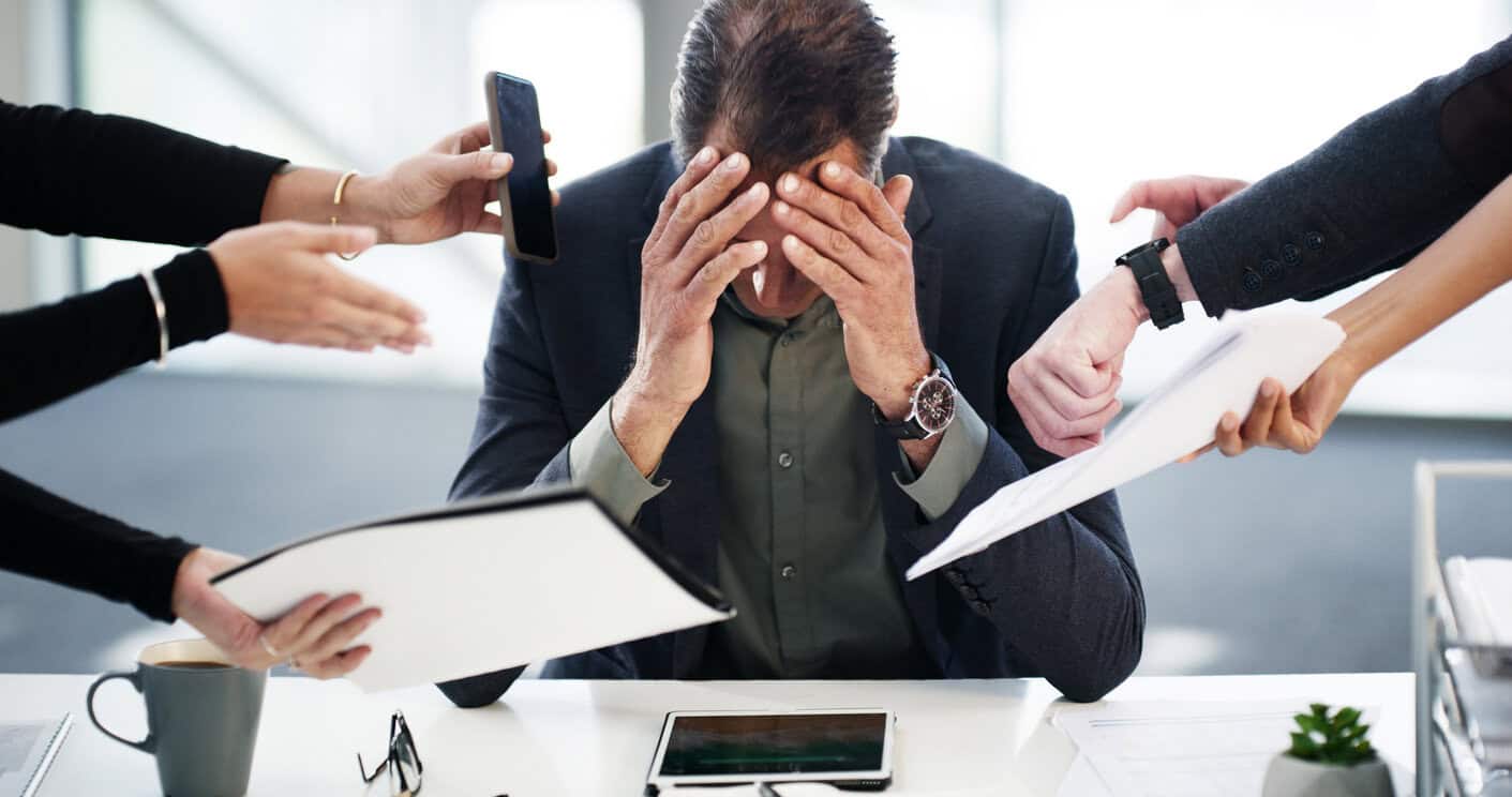 Business man, hands and stress for multitasking in office with workload demand, deadline pressure or headache. Time management, CEO and overwhelmed with phone call, paperwork procrastination or chaos