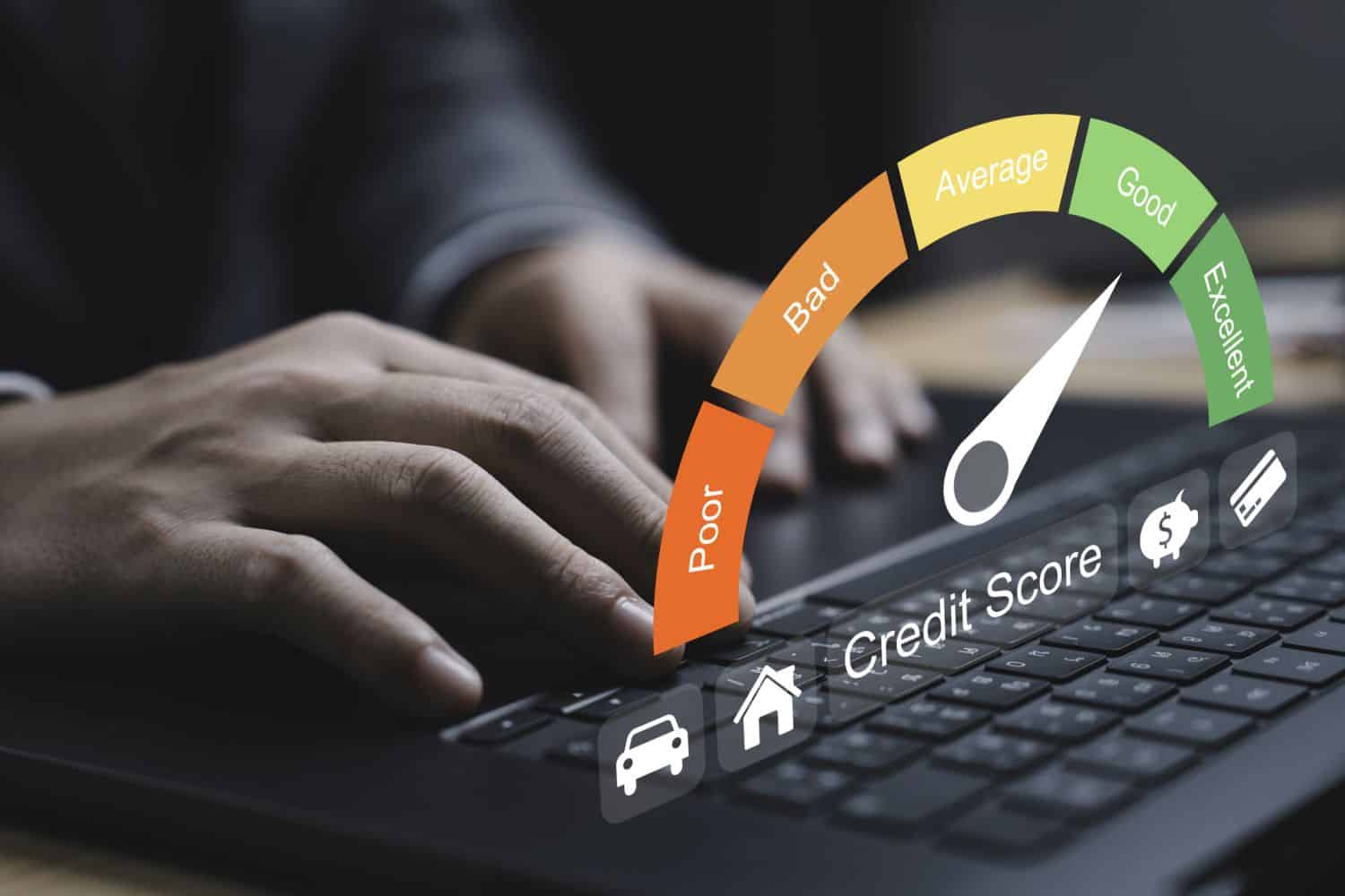 Close-up of hand typing on a laptop with a credit score gauge displayed. The gauge indicates varying levels of credit quality from poor to excellent for highlighting the importance of financial health