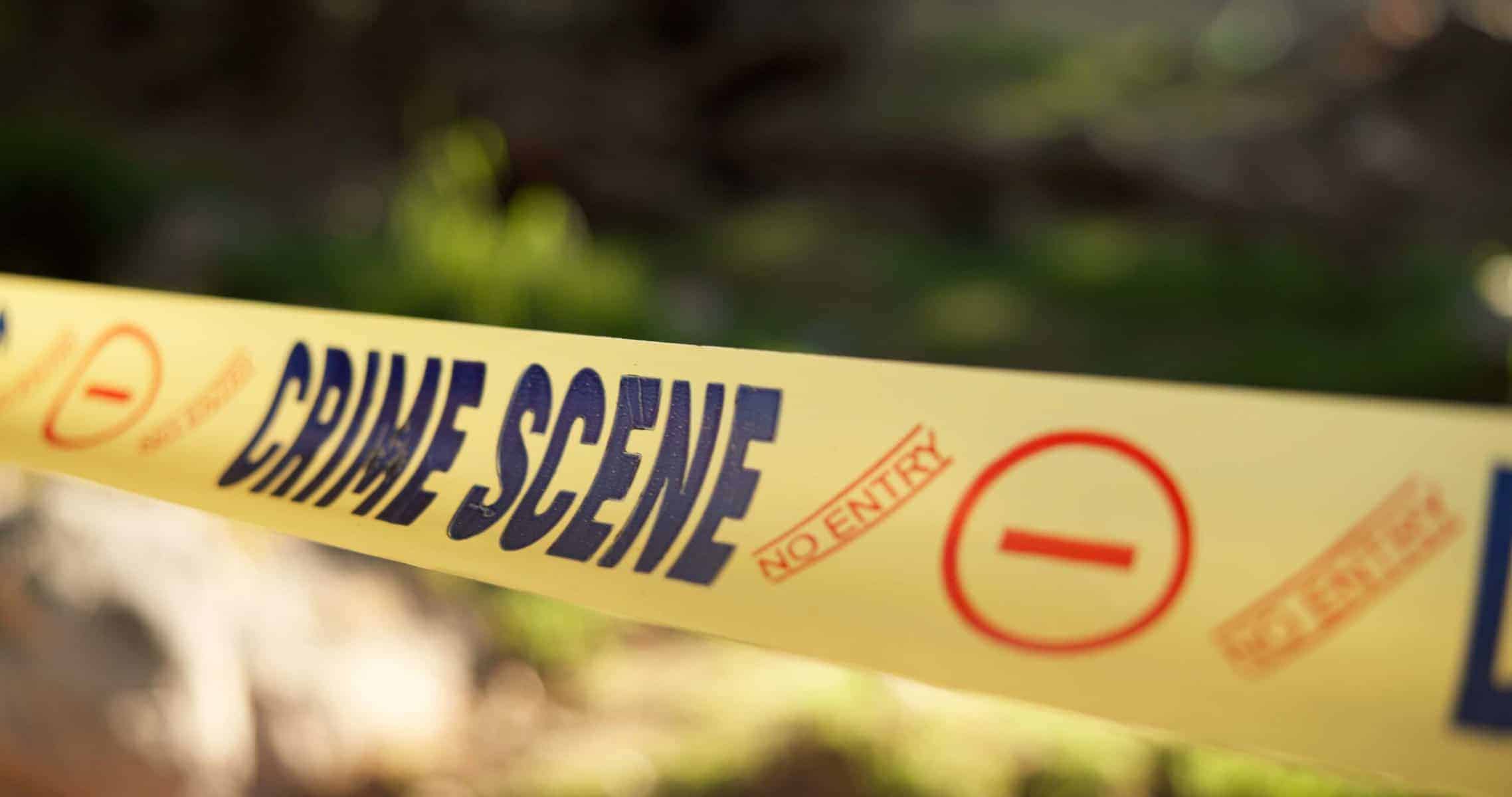 Police, yellow line or crime scene in outdoor for emergency, homicide or restricted area for investigation. Barricade, no entry or prohibition sign for public or forensic tape for accident or caution