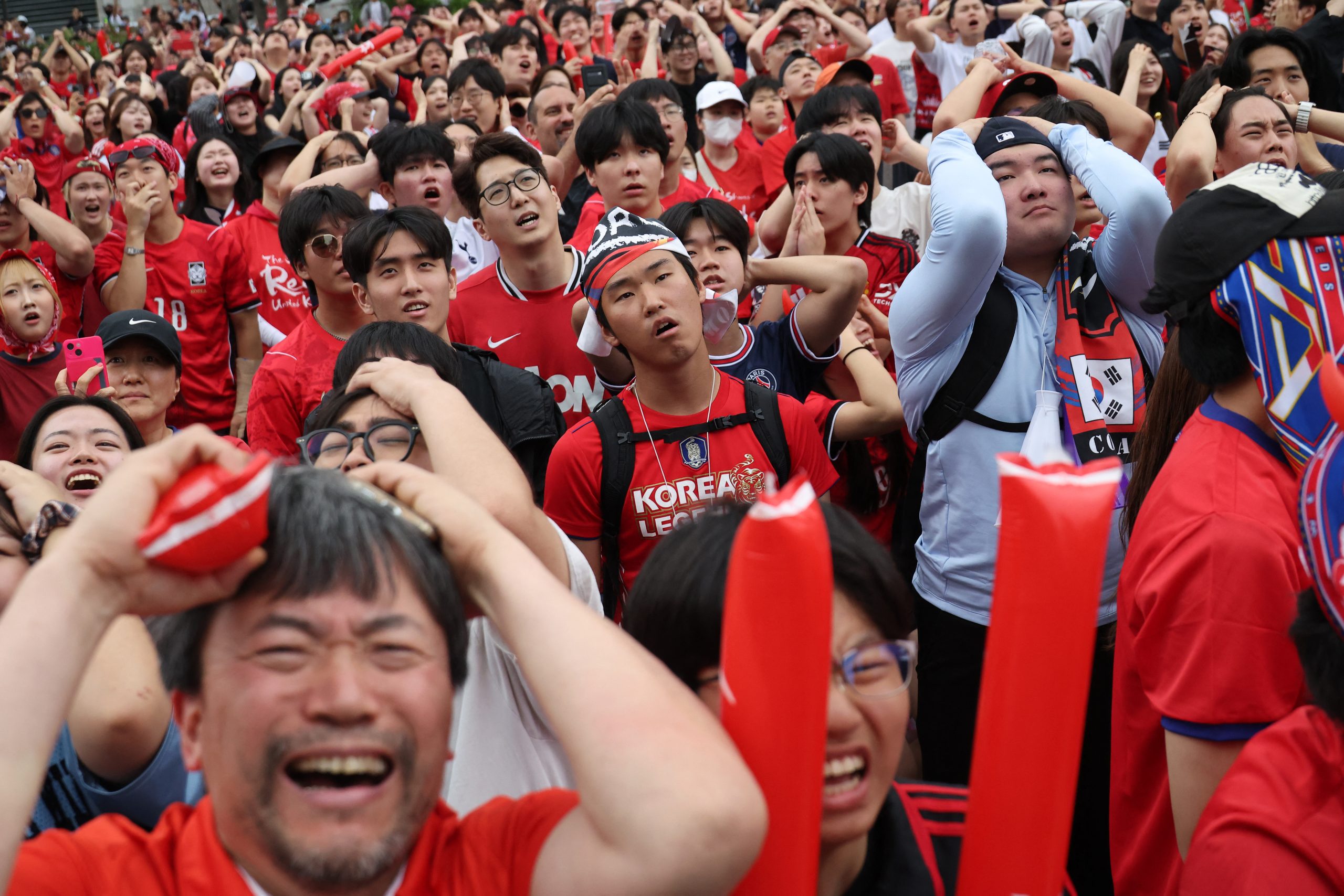 2026062026-06-25T030841Z_929509035_UP1EM6P08QFLU_RTRMADP_3_SOCCER-WORLDCUP-ZAF-KOR-FANS-SEOUL-scaled-1