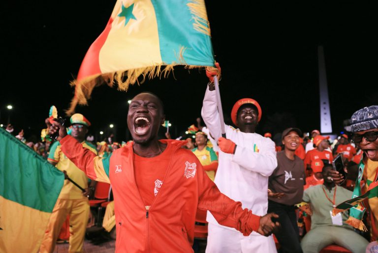 2026062026-06-26T204324Z_364269194_UP1EM6Q1LKA09_RTRMADP_3_SOCCER-WORLDCUP-SEN-IRQ-FANS-DAKAR-scaled-1