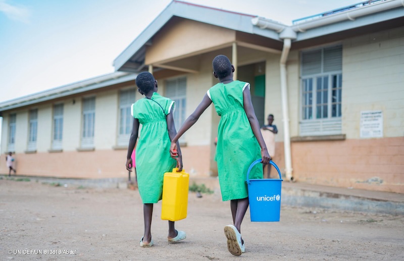 202606Girls-carrying-water-at-school