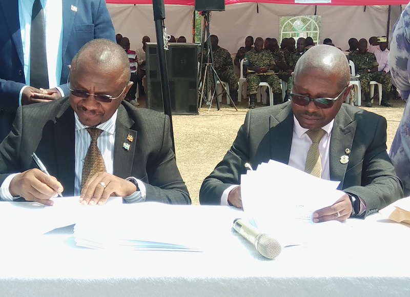 202607David-Muhwezi-and-NHCC-CEO-signed-an-MOU-for-construction-of-Mbarara-district-new-headquarters-during-the-launch-on