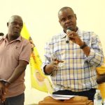 202608Minister-of-Local-Government-Balaam-Baruhagara-with-ambulance-driver-Godfrey-Mugumya